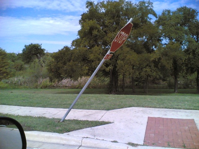 Leaning stop sign